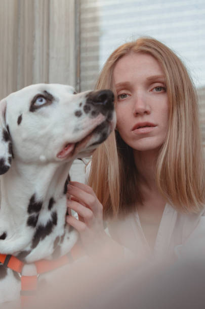 istock A young woman with her dalmatian dog 1307254812