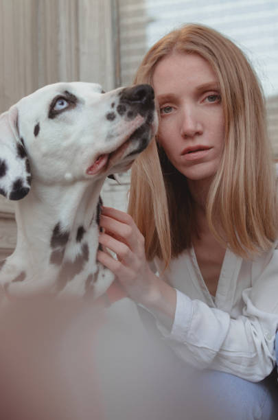 istock A young woman with her dalmatian dog 1307255473