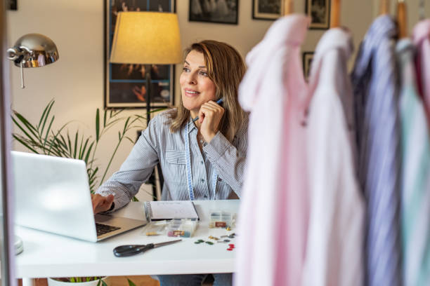 istock Mature woman working as a dressmaker in her studio 1307255872