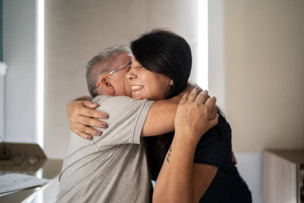 istock Happy couple embracing at home 1307257271
