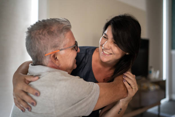 istock Happy couple embracing at home 1307257299