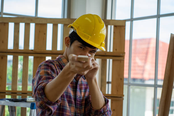 istock Asian engineer wearing safety protective hard hat working on the work station in new normal 1307262937