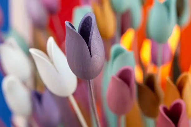Decorative multicolored wooden tulips close-up. Home decoration concept.
