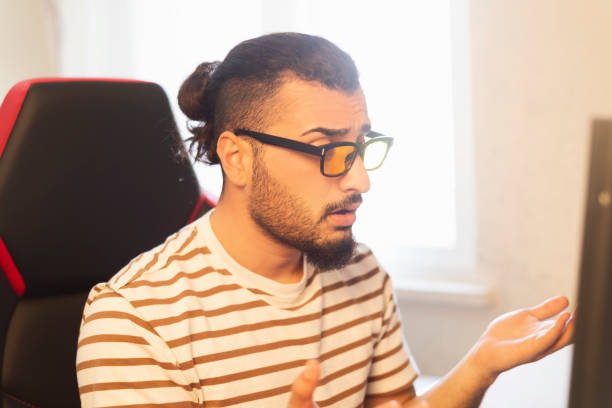 istock Young e sports player watches e sports competition on the computer. 1307265145