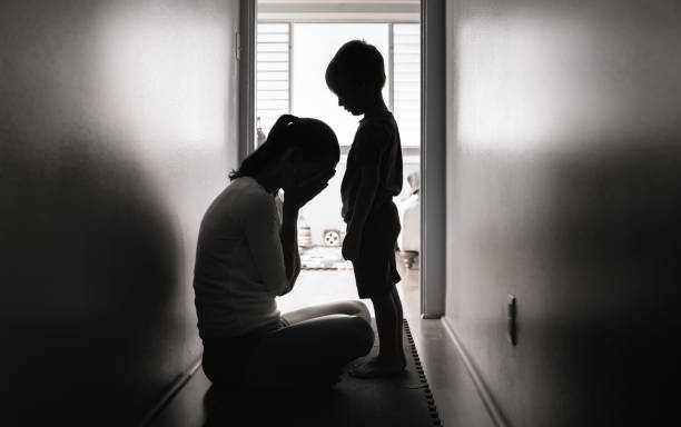 istock Sad mom with her little son at home. 1307265353
