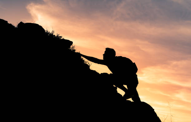 istock Male hiking at sunset. 1307265374
