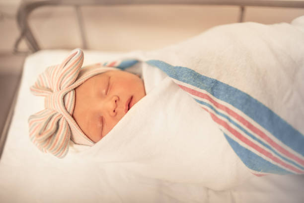 istock Newborn baby sleeping in the hospital 1307265564