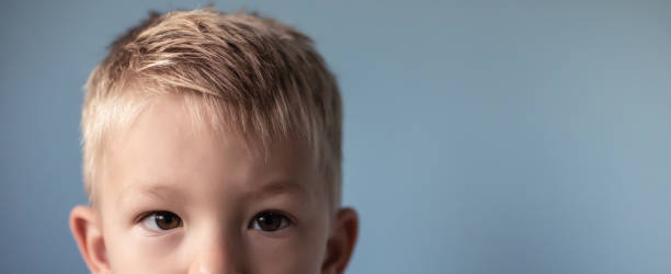 istock Fear. Abuse. Sad little boy 1307266176