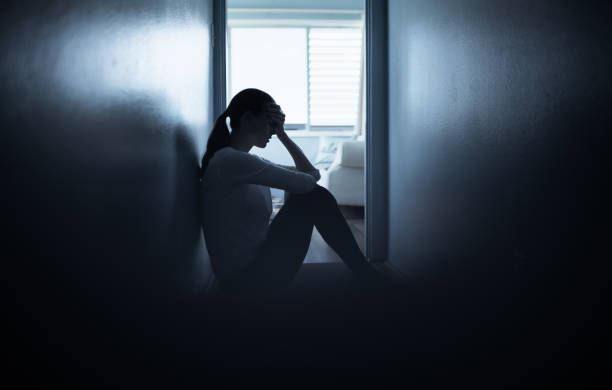 istock Sad woman at home 1307266208