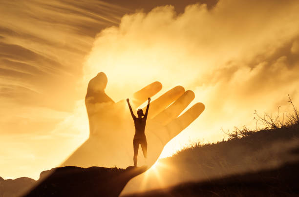 istock Woman silhouette at sunset 1307266224