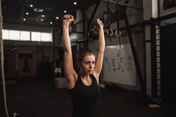 istock Sportswoman exercising at functional training gym 1307268677
