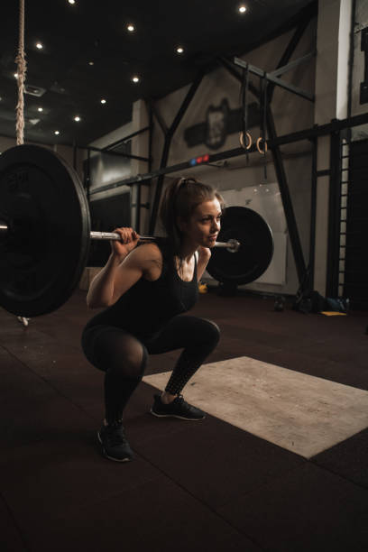 istock Sportswoman exercising at functional training gym 1307268796