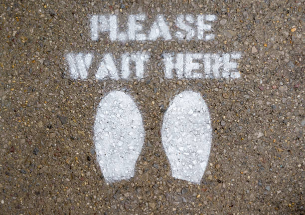 istock Please Wait Here - Coronavirus Distancing Sign on NYC Sidewalk 1307270186
