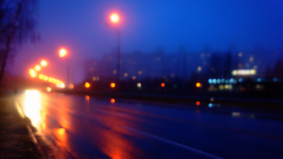Night city and road in fog, blurred background. Web banner. For design.