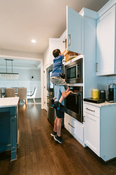 istock Kid carrying friend on shoulders 1307274270