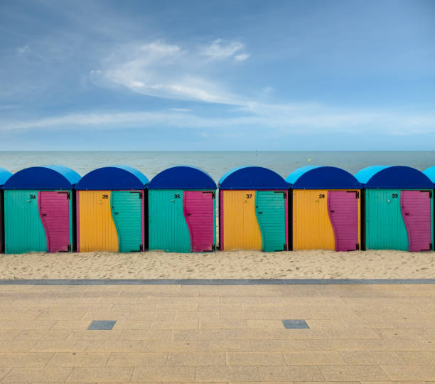 Row of vintage wooden beach huts on the beach of Dunkirk in France stock photo