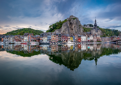 Scenic view of the town Dinant reflected in the river Meuse