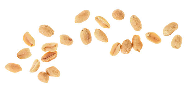 istock Peeled salted peanuts isolated on a white background, top view. 1307276163
