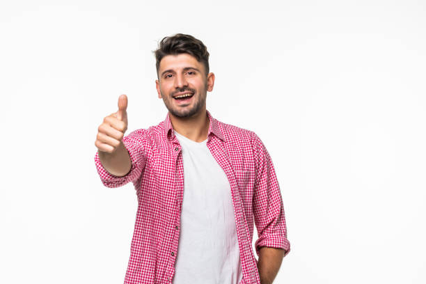 istock Happy young handsome man thumbs up white background 1307279582
