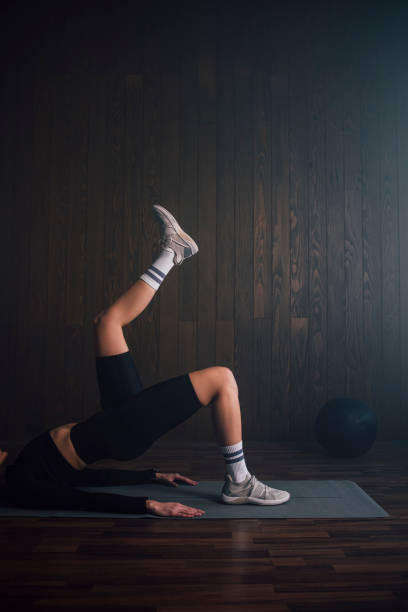 istock Healthy Lifestyle: Anonymous Woman Doing Warm Up Exercise at Home 1307281125