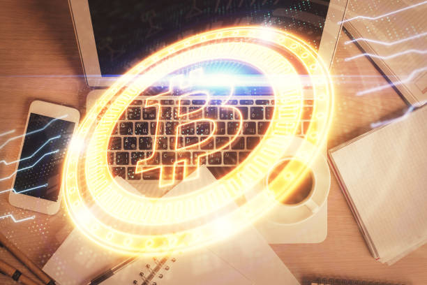 istock Blockchain theme hologram drawings over computer on the desktop background. Top view. Double exposure. 1307283584