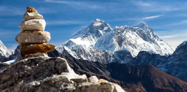 View of Mount Everest and Lhotse with stone man or pyramid from Renjo pass, Gokyo valley way to everest base camp, Khumbu valley, Sagarmatha national park, Nepal Himalayas mountains