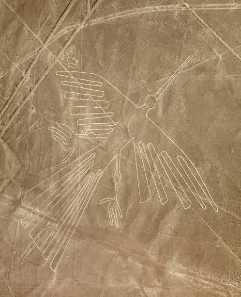 Condor geoglyph, Nazca or Nazca mysterious lines and geoglyphs aerial view sepia colored, landmark in Peru