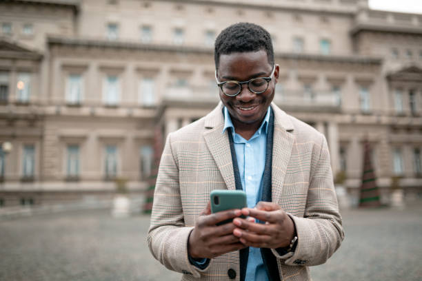 istock Happy young African American businessman using a smart phone 1307285899
