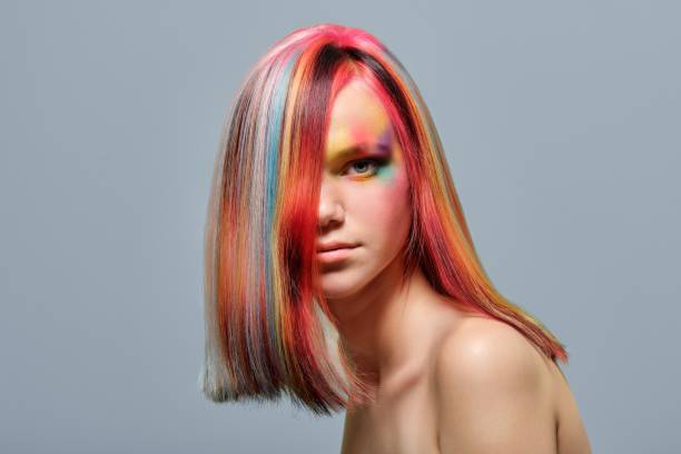 istock Beauty portrait, young model with colored hair and creative make-up 1307287916