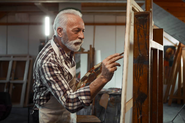 Senior artist painting Senior artist painting artists painted stock pictures, royalty-free photos & images