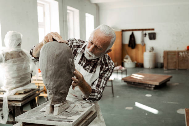 istock Shaping a head out of clay 1307288301