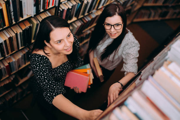 istock Two Young Women Friends Sharing Happy Time Together 1307290722