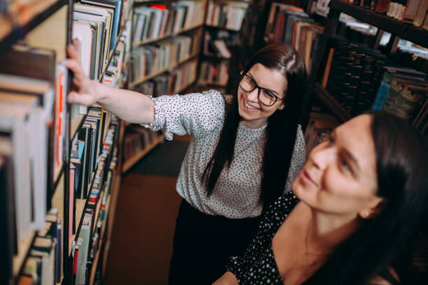 istock Two Young Women Friends Sharing Happy Time Together 1307292408