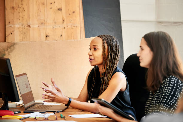 istock Business partners discussing a project in office 1307292655