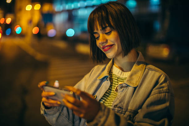 istock Happy young female using smartphone 1307293339