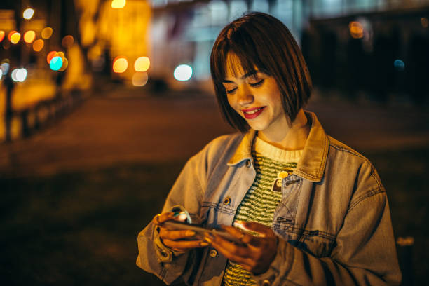 istock Happy young female using smartphone 1307293342