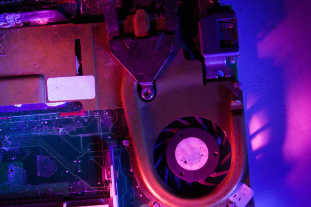 istock Electronic motherboard in colored blue and purple light. 1307293665