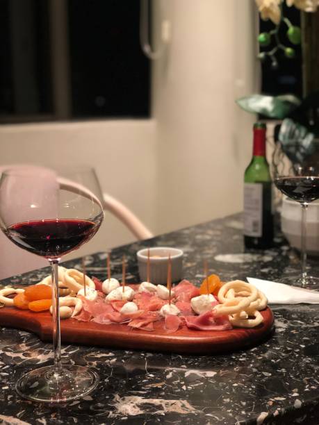 Red wine with parma ham, dry apricot and crackers