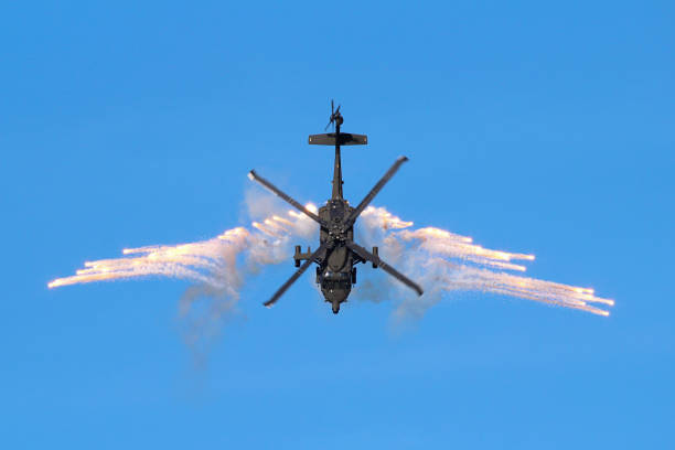 Military Helicopter Shooting Flares into Blue Sky in Rionegro, Antioquia, Colombia