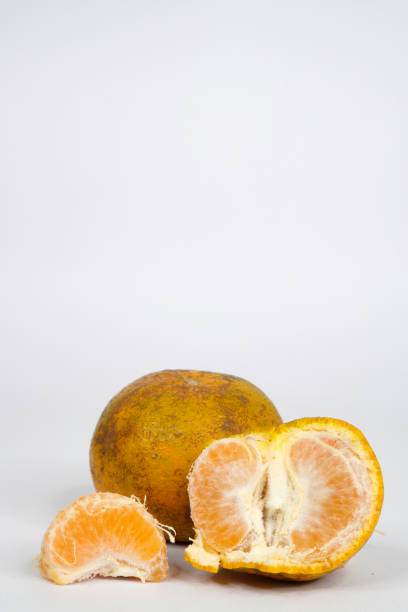 istock A dirty orange and a peeled off orange 1307297935