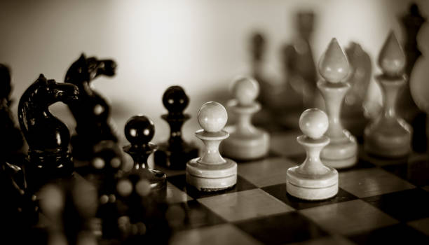 istock Wooden chess pieces on the chessboard. Intellectual game -chess 1307298180