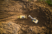 Aerial view of excavator and bulldozer on construction site