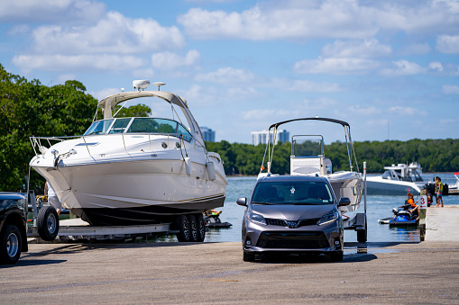 Steering wheel and control panel on luxury motorboat, background with copy space, full frame horizontal composition