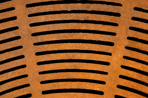 Rusted storm drain grate.