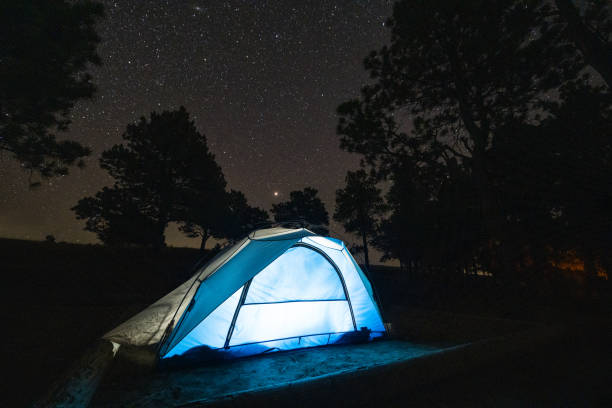 istock Camping Tent Illuminated at Night Outdoors in Keyhole State Park Wyoming 1307303927