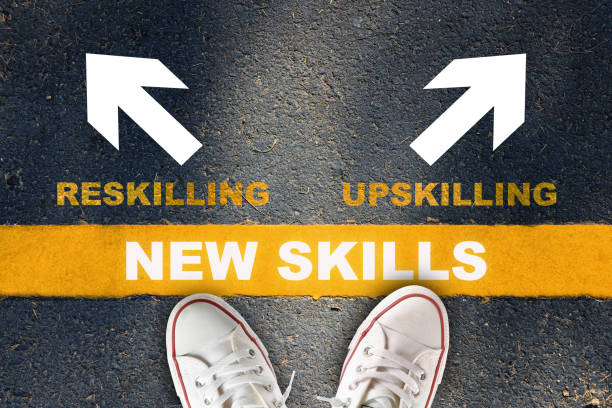 New skills development concept and changing skill demand idea New skills written on yellow line with reskilling and upskilling with white arrow on asphalt road revolution photos stock pictures, royalty-free photos & images