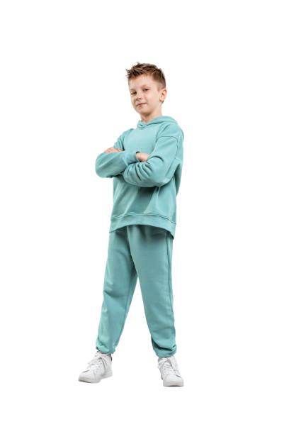 boy in a turquoise suit and white sneakers isolated on a white background.