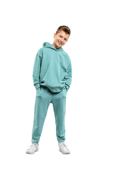 boy in a turquoise suit and white sneakers isolated on a white background.