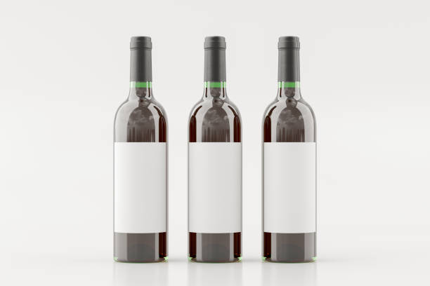 istock Three red wine bottles 750ml mock up with blank label on white background. 1307321682