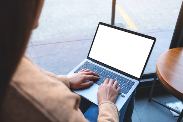 istock a woman using and typing on laptop computer with blank white desktop screen in cafe 1307321747
